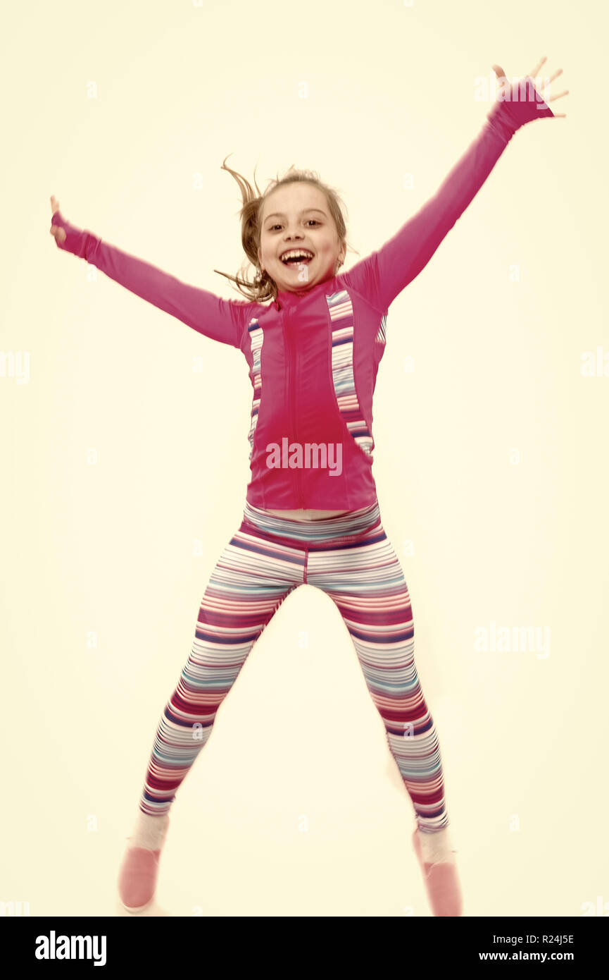 Child in pink sportswear. Education and energy. Sport and success