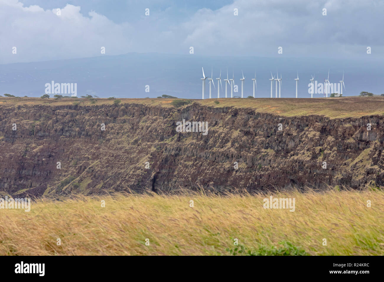 Ka Lae, Hawaii - The Pakini Nui Wind Farm at South Point on Hawaii's Big Island. The wind is almost constantly blowing at South Point, which is the so Stock Photo
