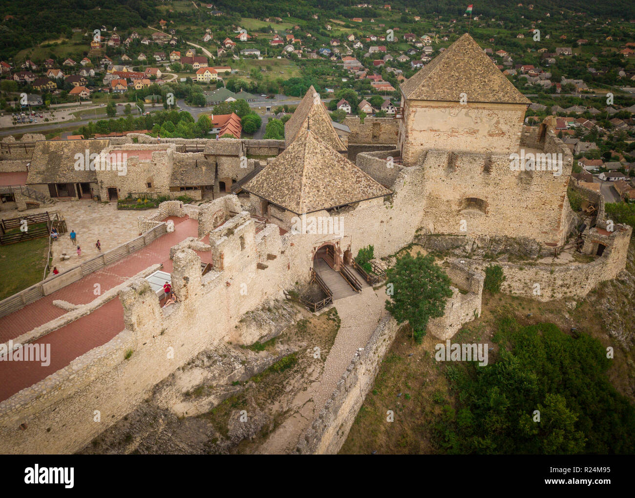 Aerial panorama of famous medieval castle ruin in Sumeg Hungary near the Lake Balaton partially restored with donjon, bastions, gate house, loop holes Stock Photo