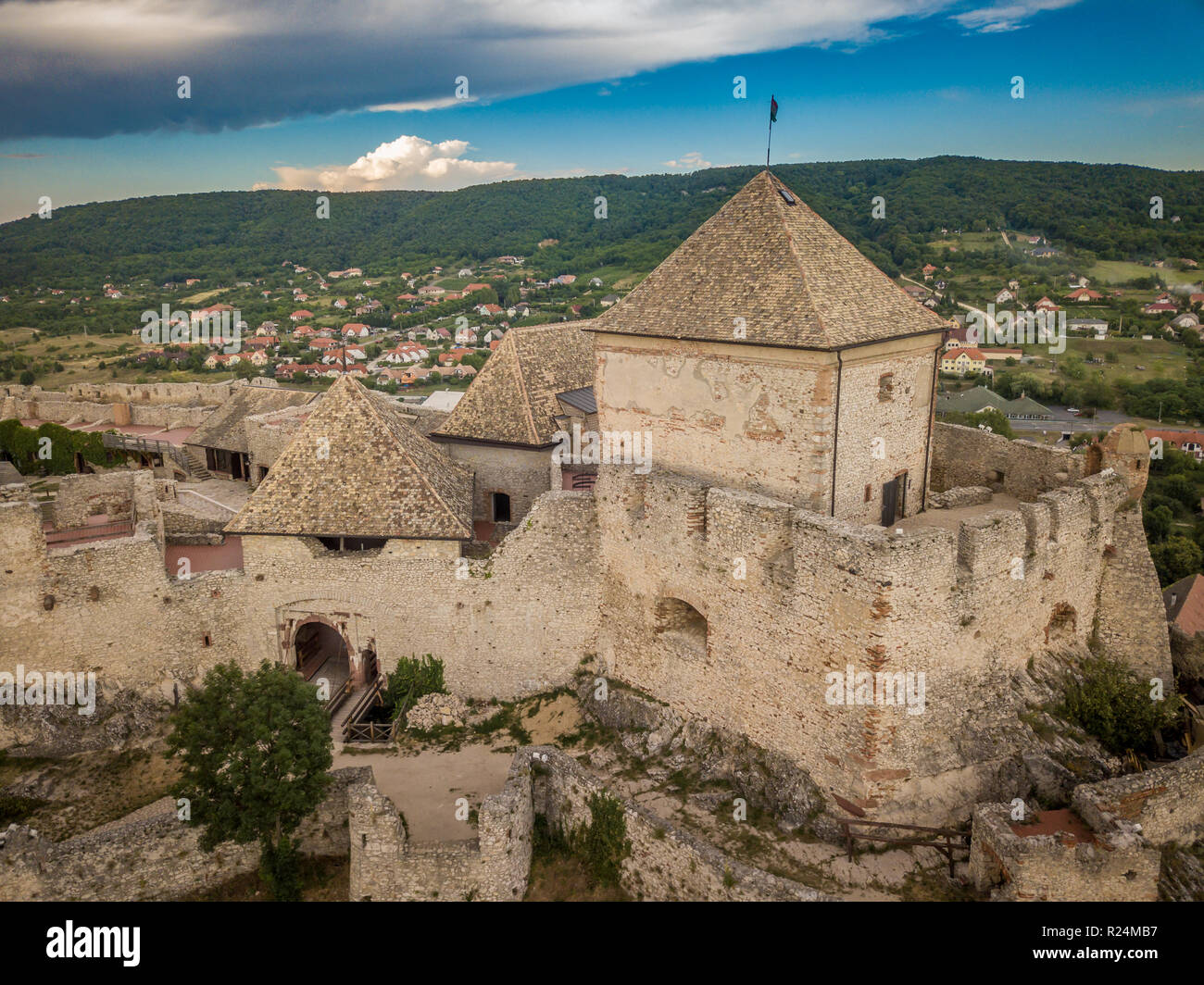 Aerial panorama of famous medieval castle ruin in Sumeg Hungary near the Lake Balaton partially restored with donjon, bastions, gate house, loop holes Stock Photo