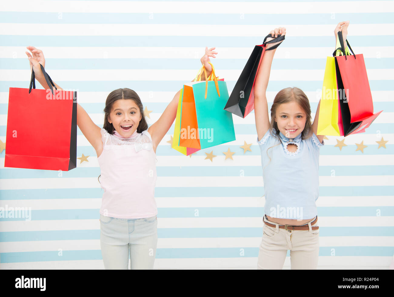 Black friday coming. Kids girls children with packages after shopping day.  Girls friends happy carry paper bags. Best discount promo code. Black friday  shopping great opportunity profitable purchase Stock Photo - Alamy