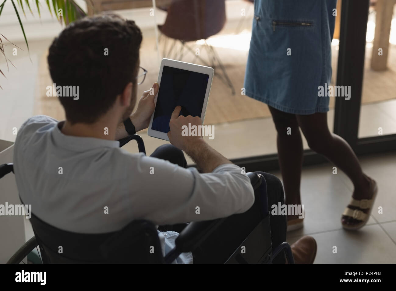 Handicap executive using digital tablet in office Stock Photo
