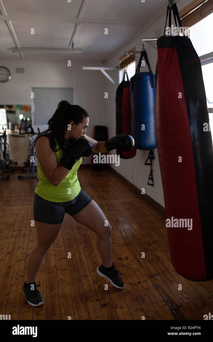Female boxer practicing boxing in fitness studio Stock Photo - Alamy