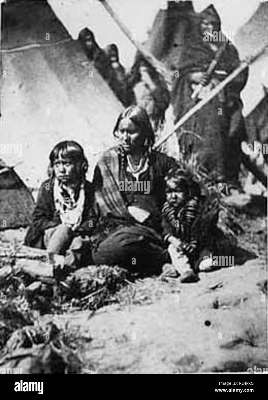 Little Crow's wife and two children at Fort Snelling prison compound, 1864 Stock Photo