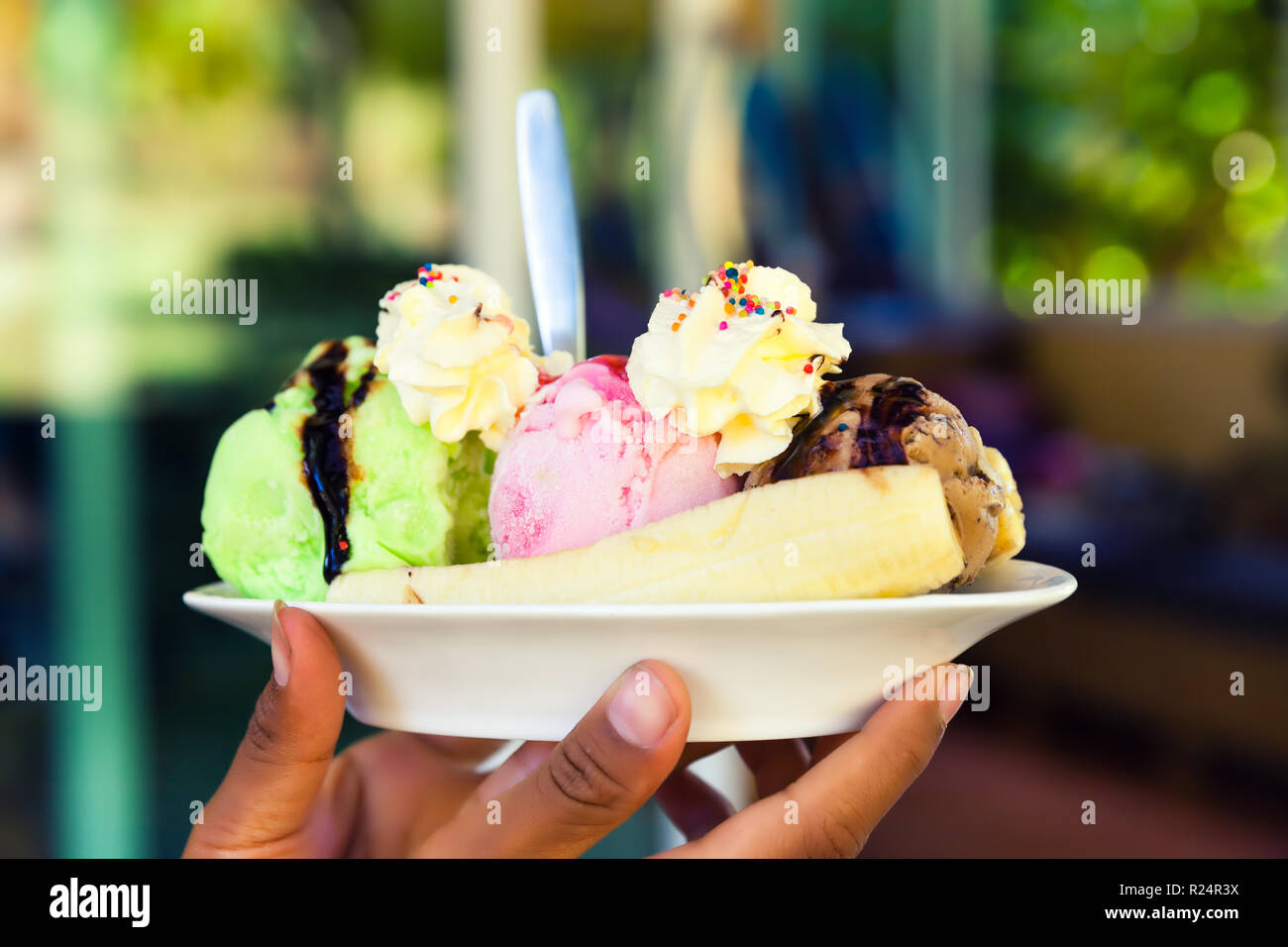 Fresh natural ice cream on beautiful blurred background in popular tourist restaurant Gusto Gelato & Caffe in Bali Stock Photo