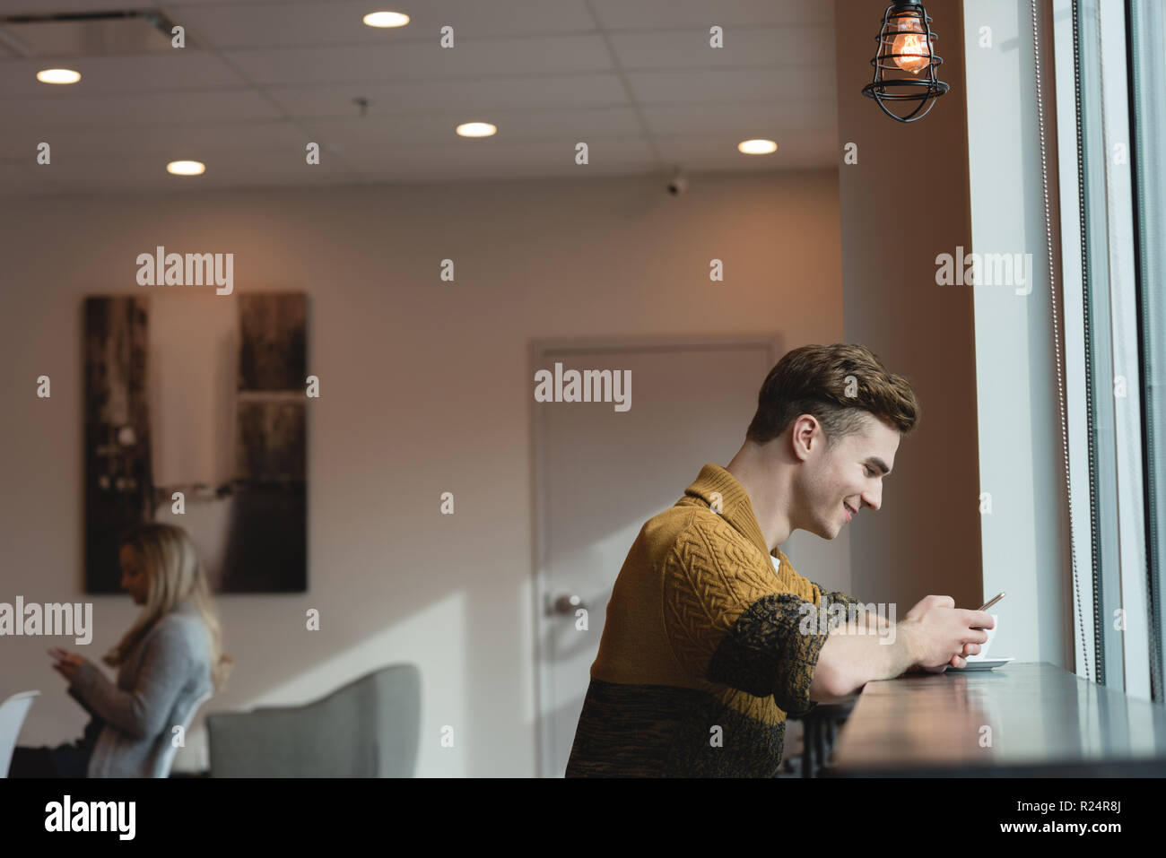 Man in cafe typing hi-res stock photography and images - Alamy