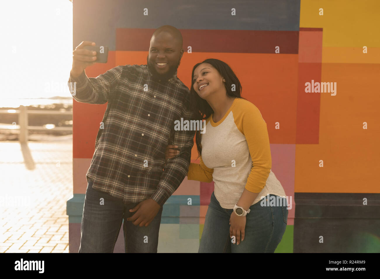 Couple taking selfie on promenade Stock Photo