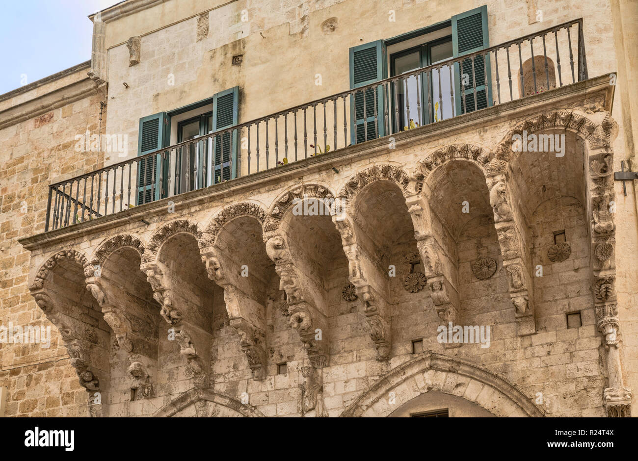 Carved corbels at balcony, Loggia Balsamo, 14th century, in Brindisi, Apulia, Italy Stock Photo
