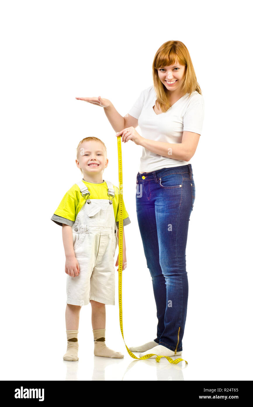 woman measuring child isolated on a white background Stock Photo