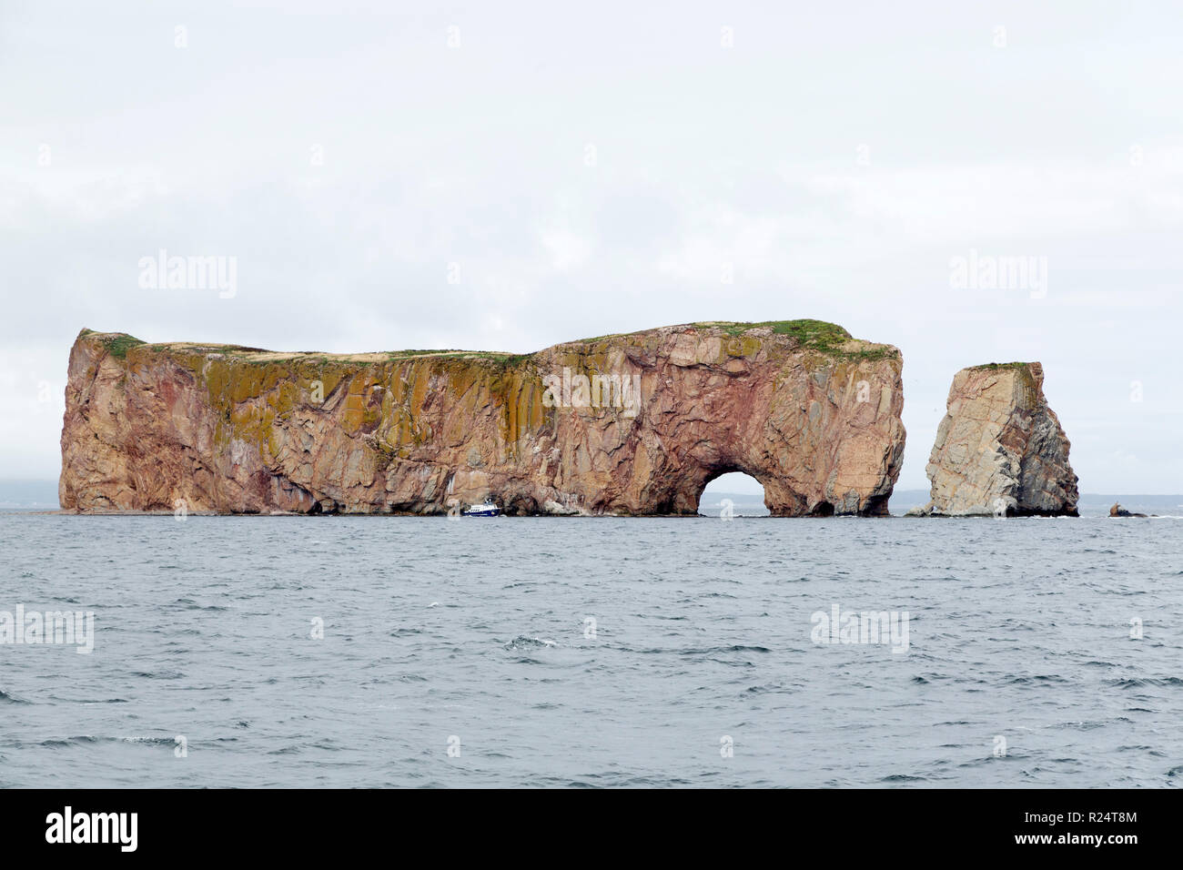 Perce Rock off the Gaspe Peninsula of Quebec, Canada. The rock stands off Perce in the Gulf of St Lawrence. Stock Photo