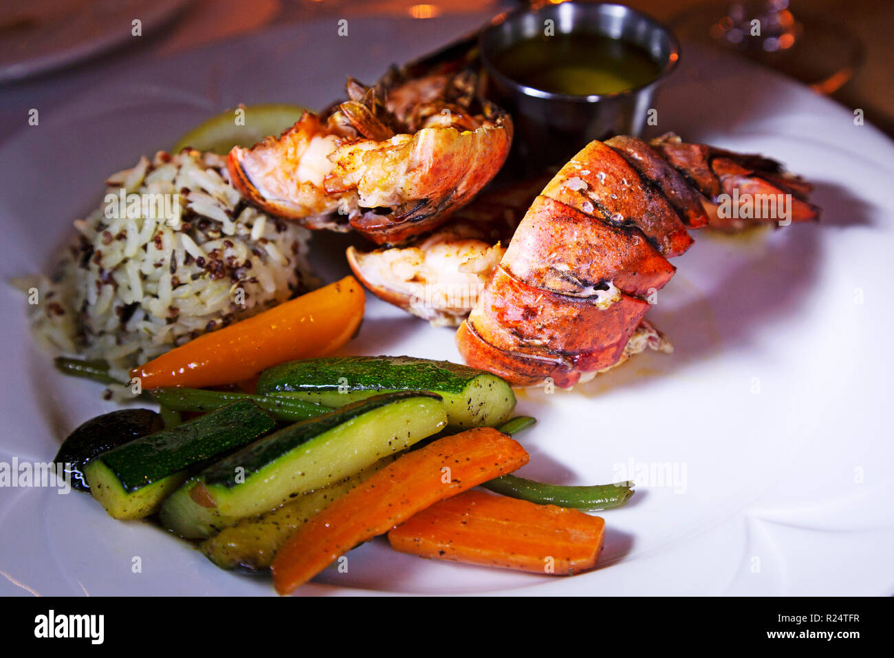 Lobster tail served in Canada.. It is served accompanied by rice and vegetables. Stock Photo