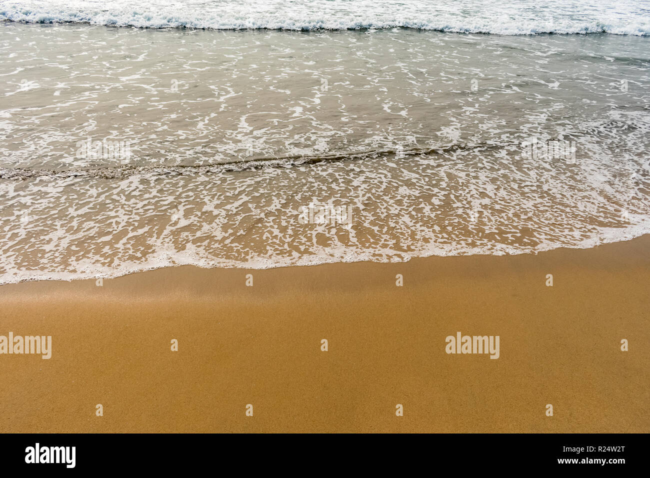 A beautiful pattern of sea water with foam created after collide sea ...