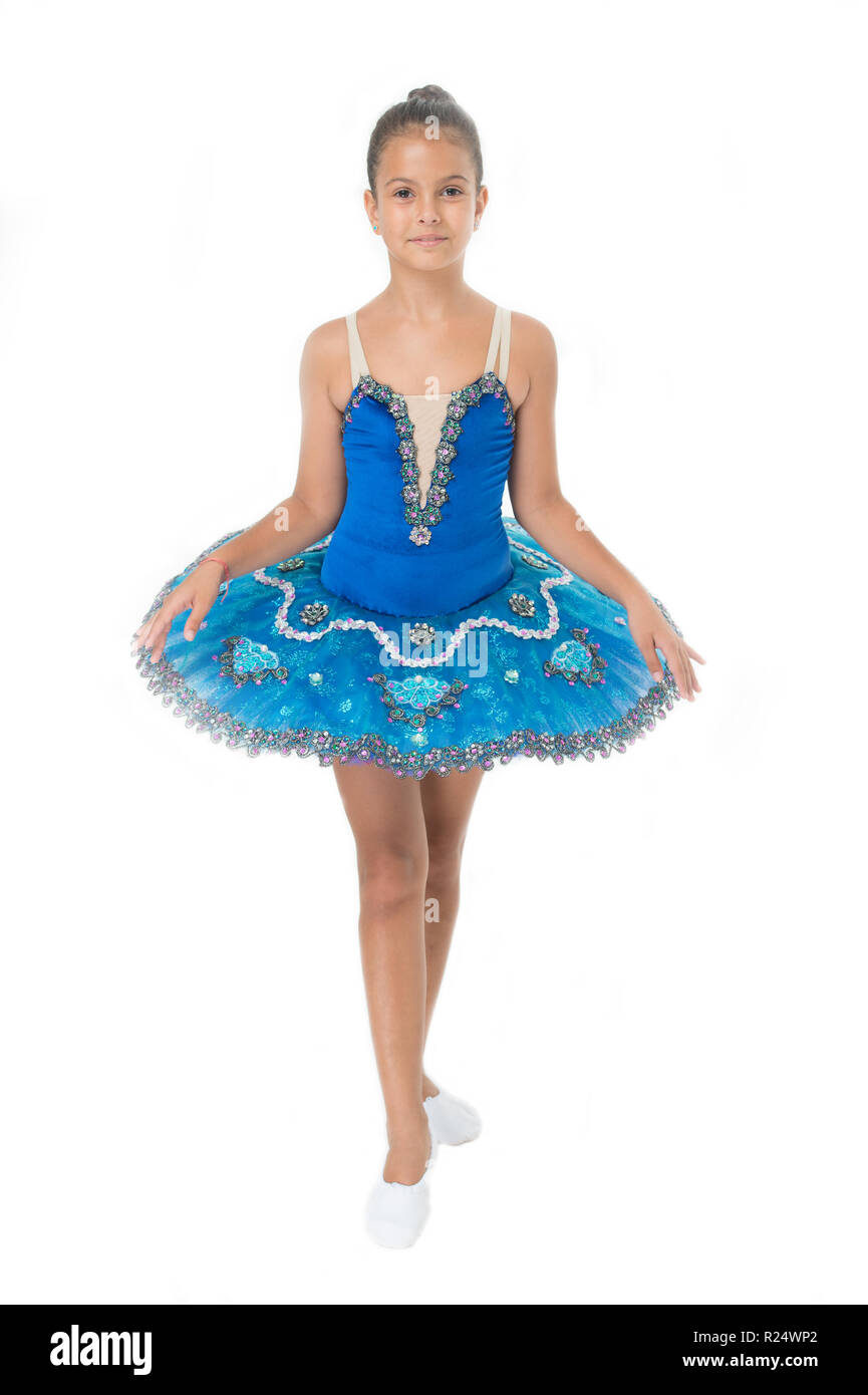 little girl in ballet position. Little ballerina in blue tutu. Adorable ballerina girl take dance lesson. Dancing queen. It takes discipline to be the best. Stock Photo