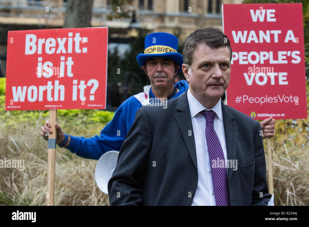 London, UK. 16th November, 2018. Gerard Batten, Leader of UKIP, appears on College Green in Westminster as uncertainty continues around the survival of Prime Minister Theresa May's Government and the number of letters of no confidence submitted to the 1922 Committee. Anti-Brexit activist Steve Bray of SODEM stands behind him holding two placards. Credit: Mark Kerrison/Alamy Live News Stock Photo