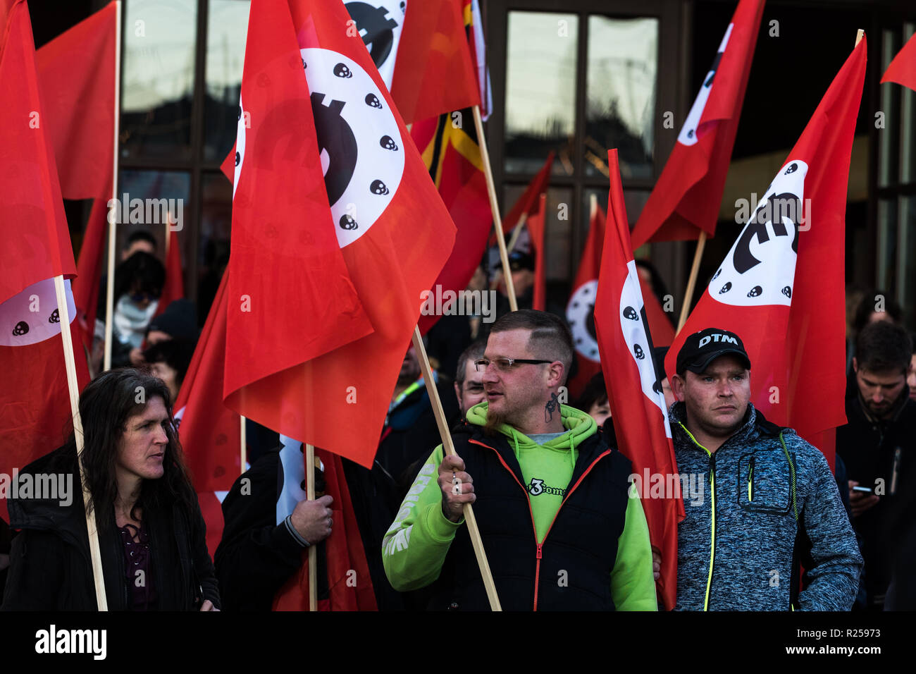 Counter protesters seen holding flags during the right-wing protest. Right-wing protests against Merkel's visit to Chemnitz, Deutschland. The Chancellor visited the city and talked to the citizens in a citizens' forum after protests and riots broke out in August after a violent death of a 35-year-old man from Chemnitz. Stock Photo