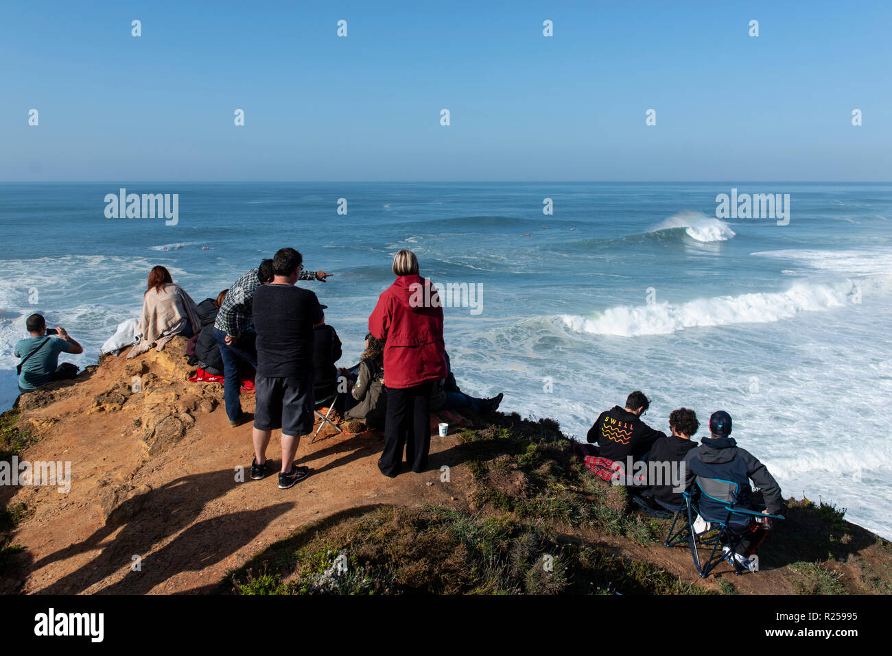 People seen watching the first stage of the World Surf League. The