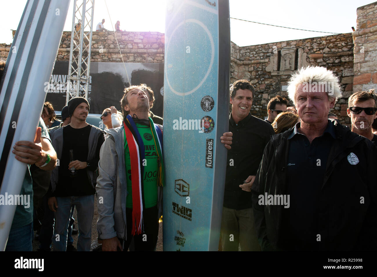 Big wave surfer Grant Baker (ZAF)  (2nd L) is seen before receiving the first winner prize at the Nazare Challenge, Portugal. The first stage (Nazaré Challenge) of the World Surf League (WSL) Big Wave Tour took place in Nazaré, Portugal. South African surfer Grant Baker won the Portuguese competition. Stock Photo