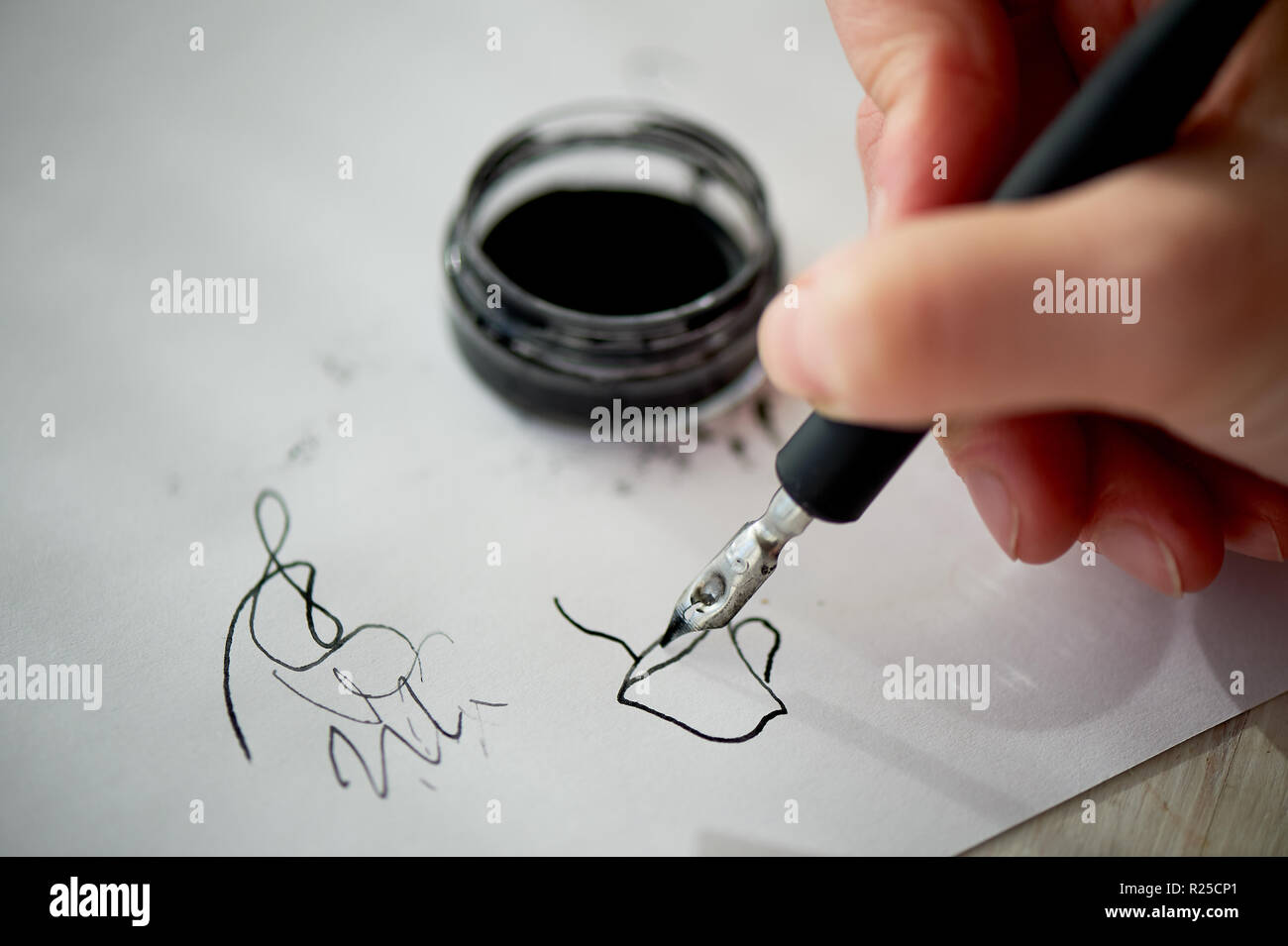 A woman's hand writes with ink, a fountain pen. Writing. The creative