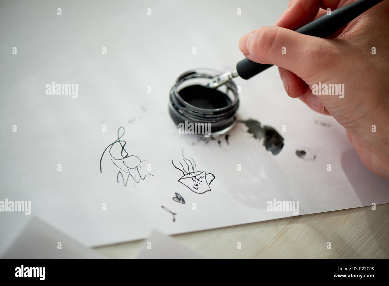 Using Writing Ink A woman's hand writes with ink, a fountain pen. Writing. The creative ...