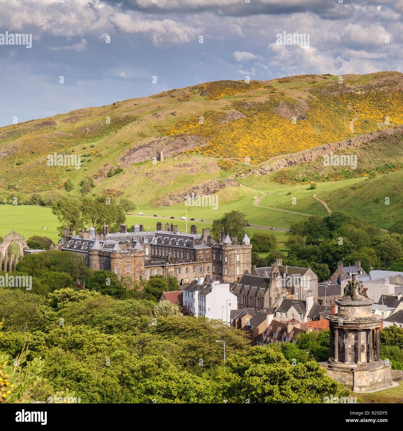 Edinburgh, Scotland, UK - May 30, 2011: Summer sun shines on the Palace of Holyroodhouse in Edinburgh, with Arthur's Seat rising behind in Holyrood Pa Stock Photo