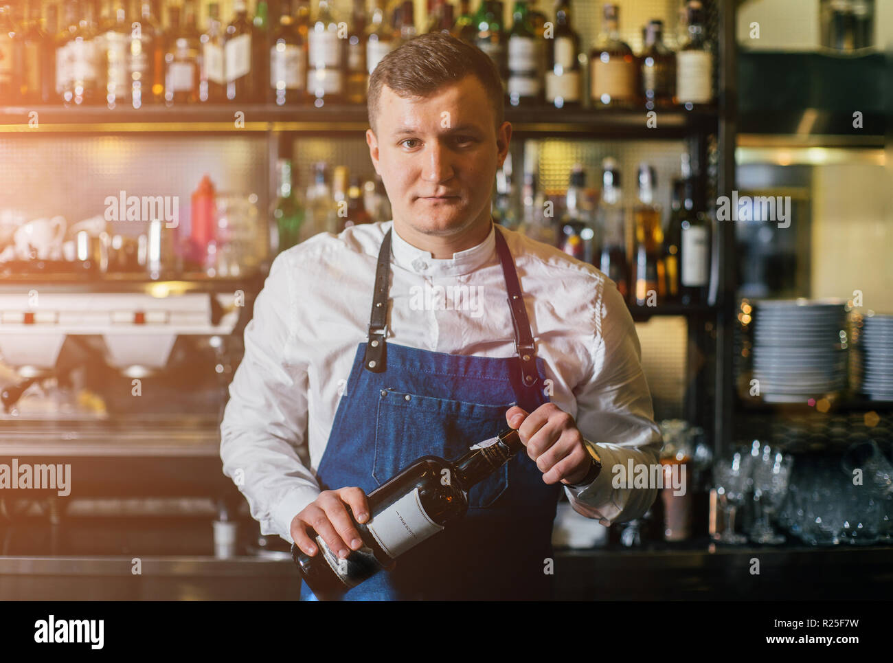 Bartender professionally working with om making drinks and cocktails Stock Photo