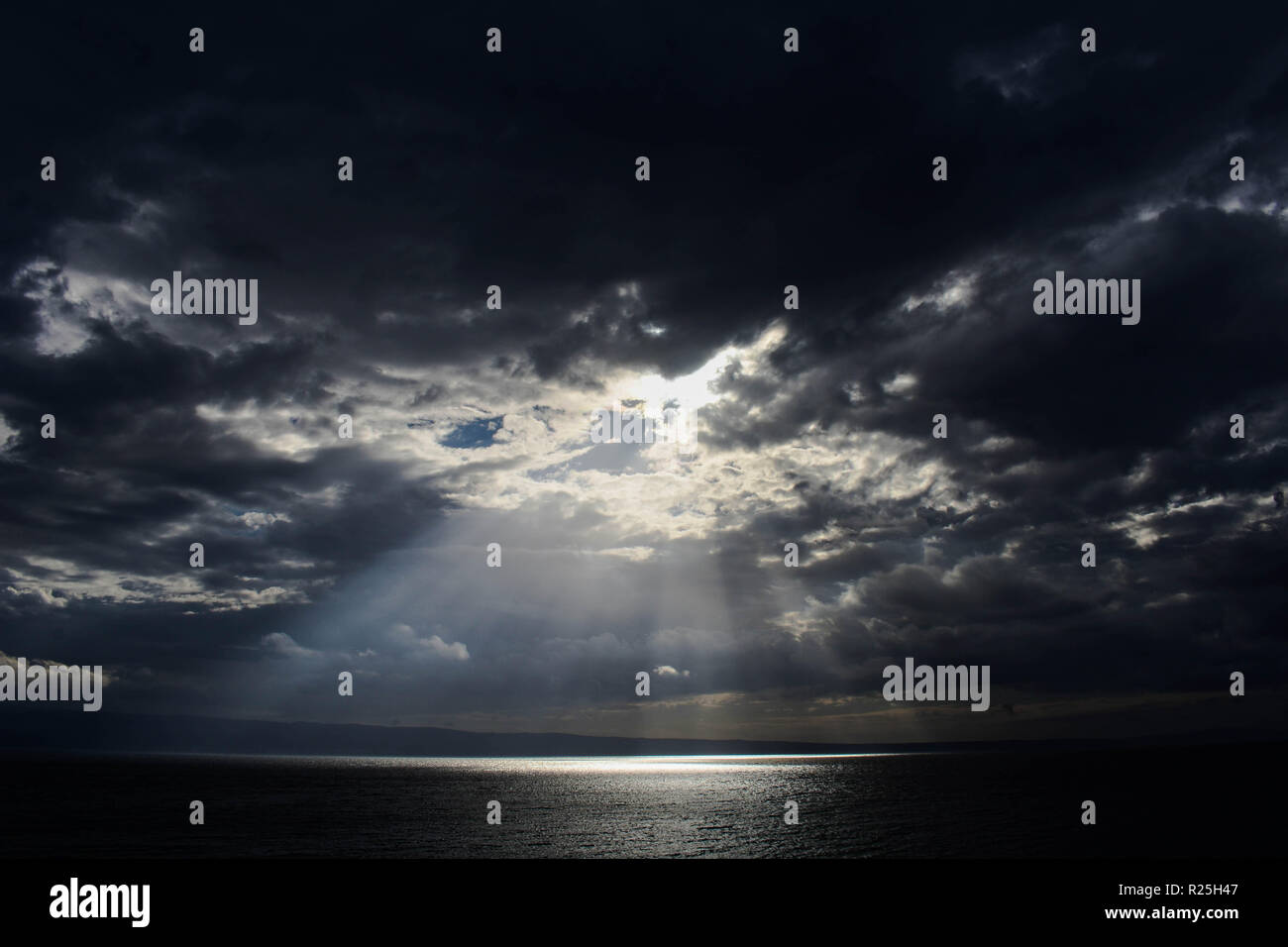 rays of the sun beautifully make their way through the clouds ...