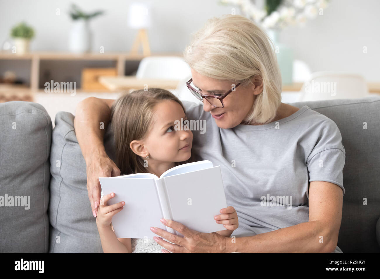 grandma reads book to baby