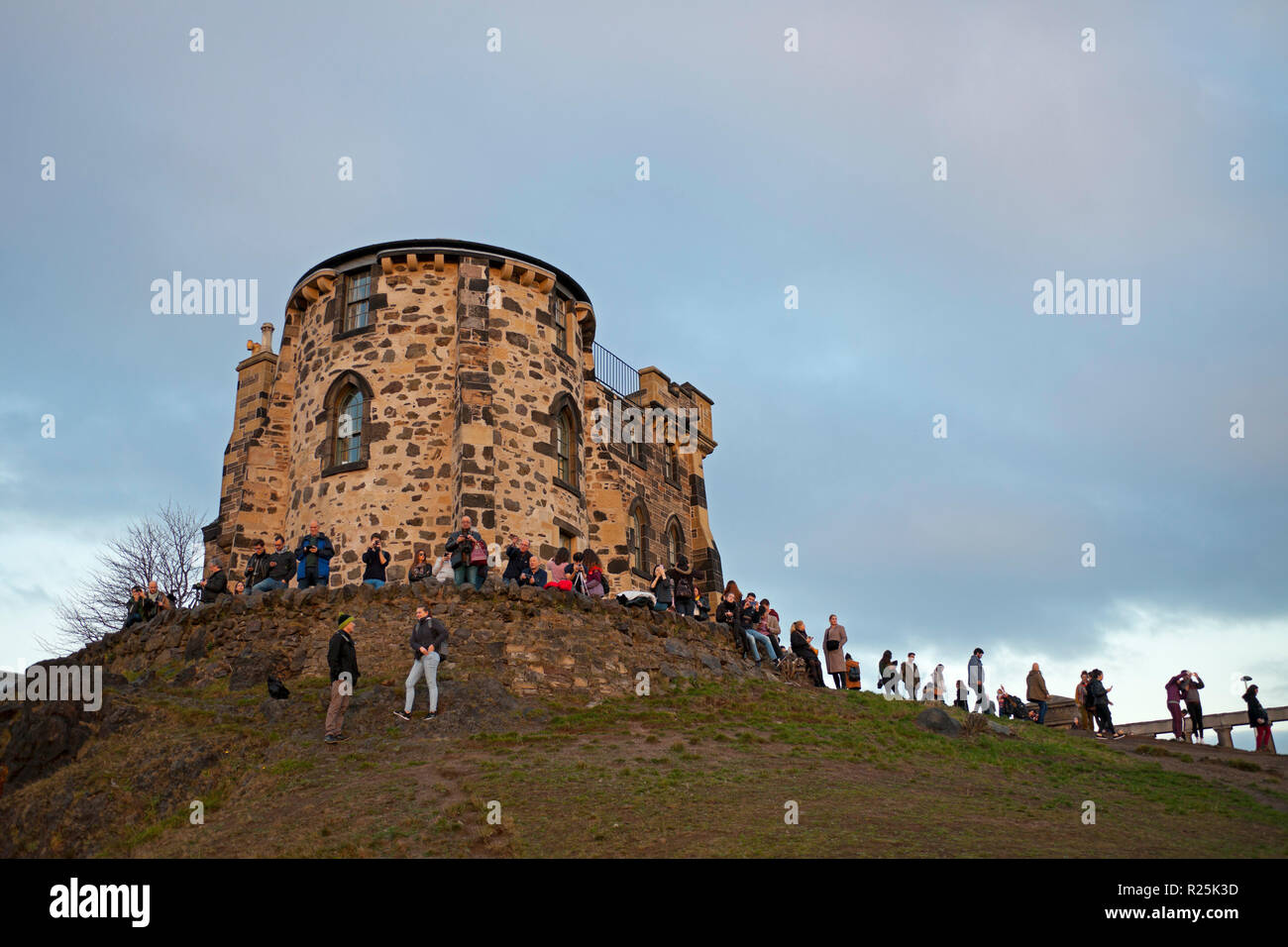 Observatory House at sunset with many tourists, Calton Hill, Edinburgh, Scotland, UK Stock Photo