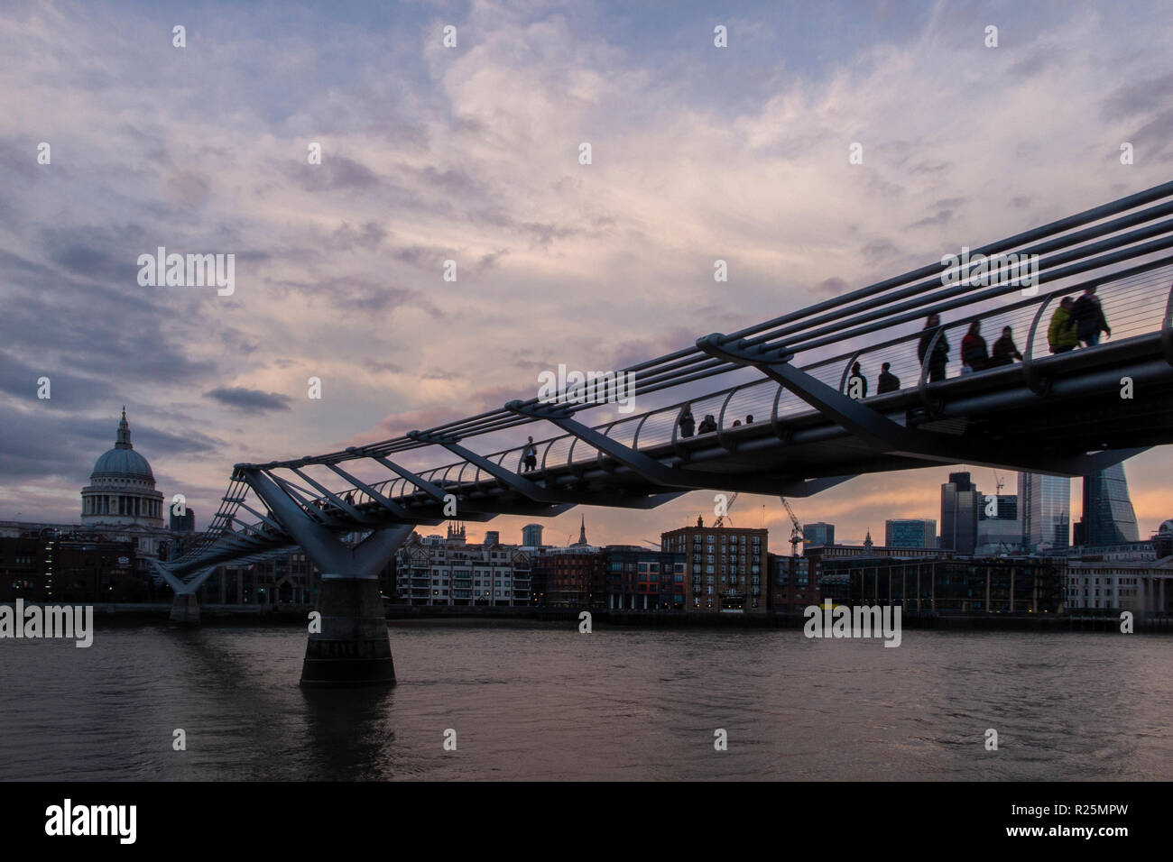 A classic view of the Millennium Bridge at dusk Stock Photo