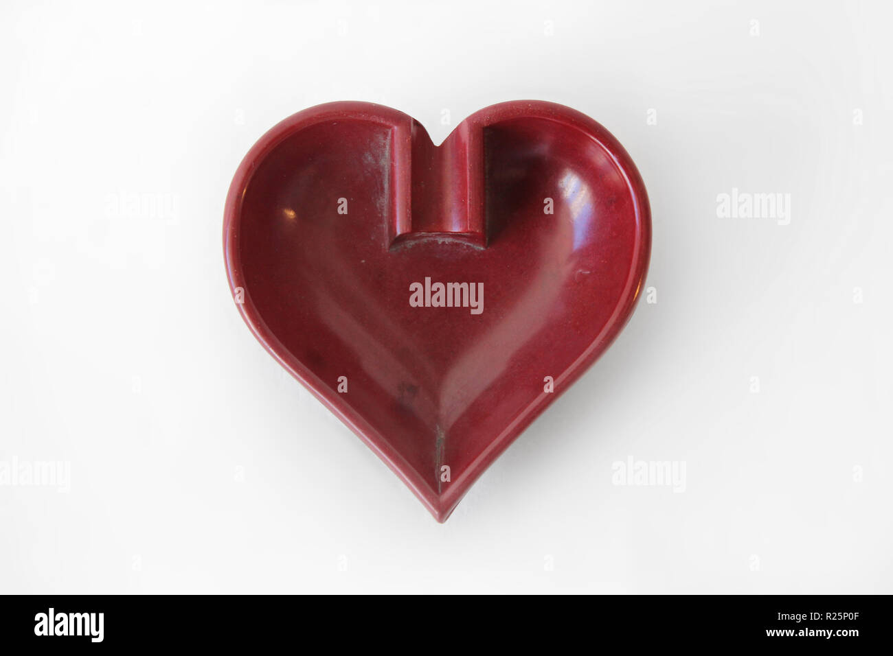 Heart shaped ashtray isolated on a white background, close-up Stock