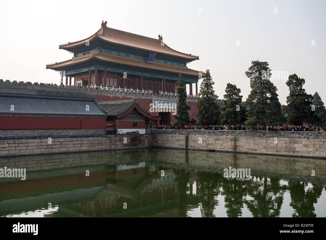 Crowds go through Gate of Divine Prowess in Forbidden City Stock Photo