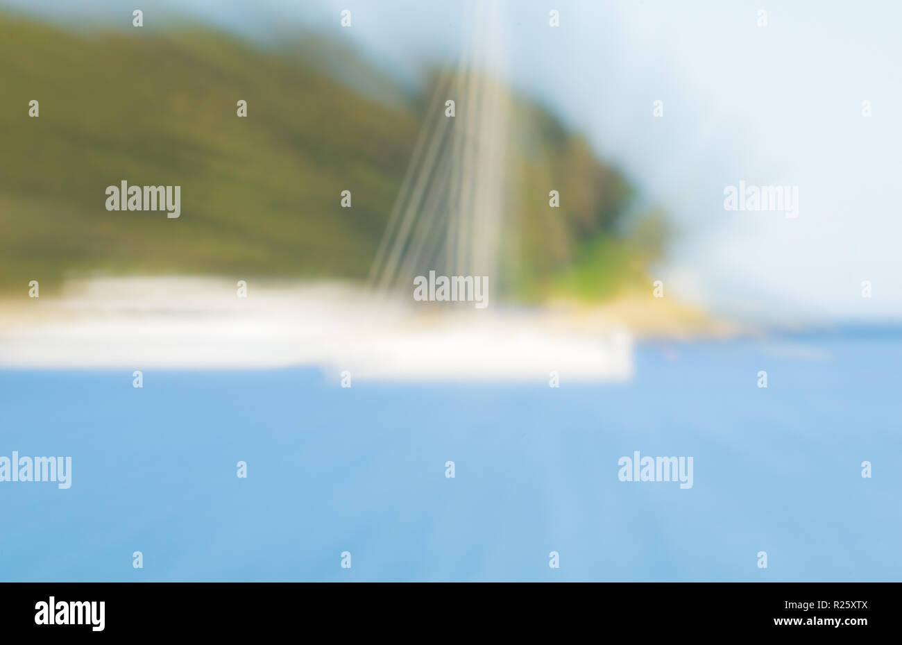 Background image abstract zoom blur at beach with hint of morred yacht Stock Photo