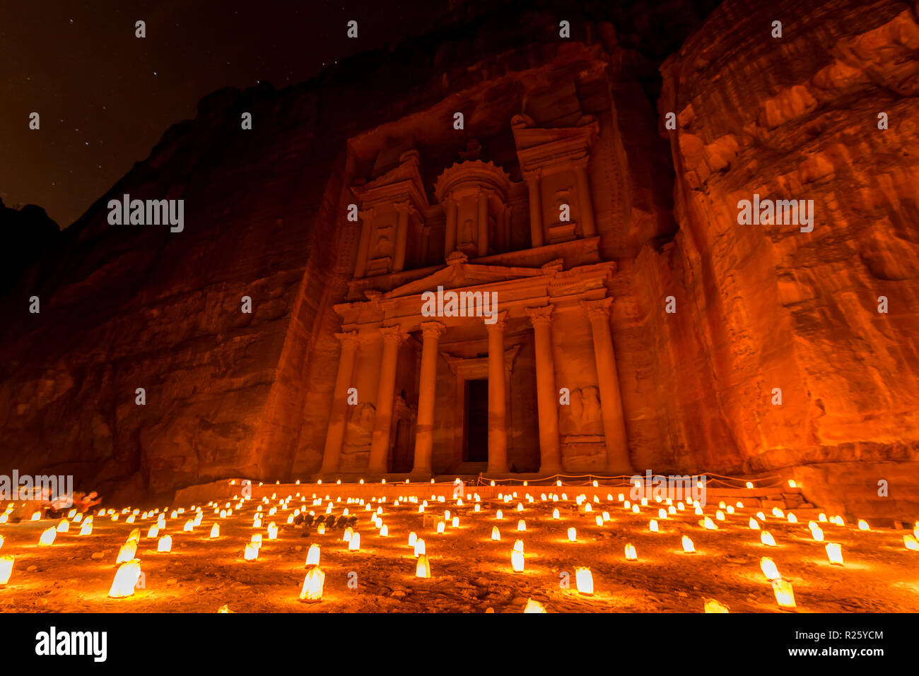 Candles in front of the Pharaoh's treasure house, struck in rock, at night, facade of the treasure house Al-Khazneh, Khazne Stock Photo