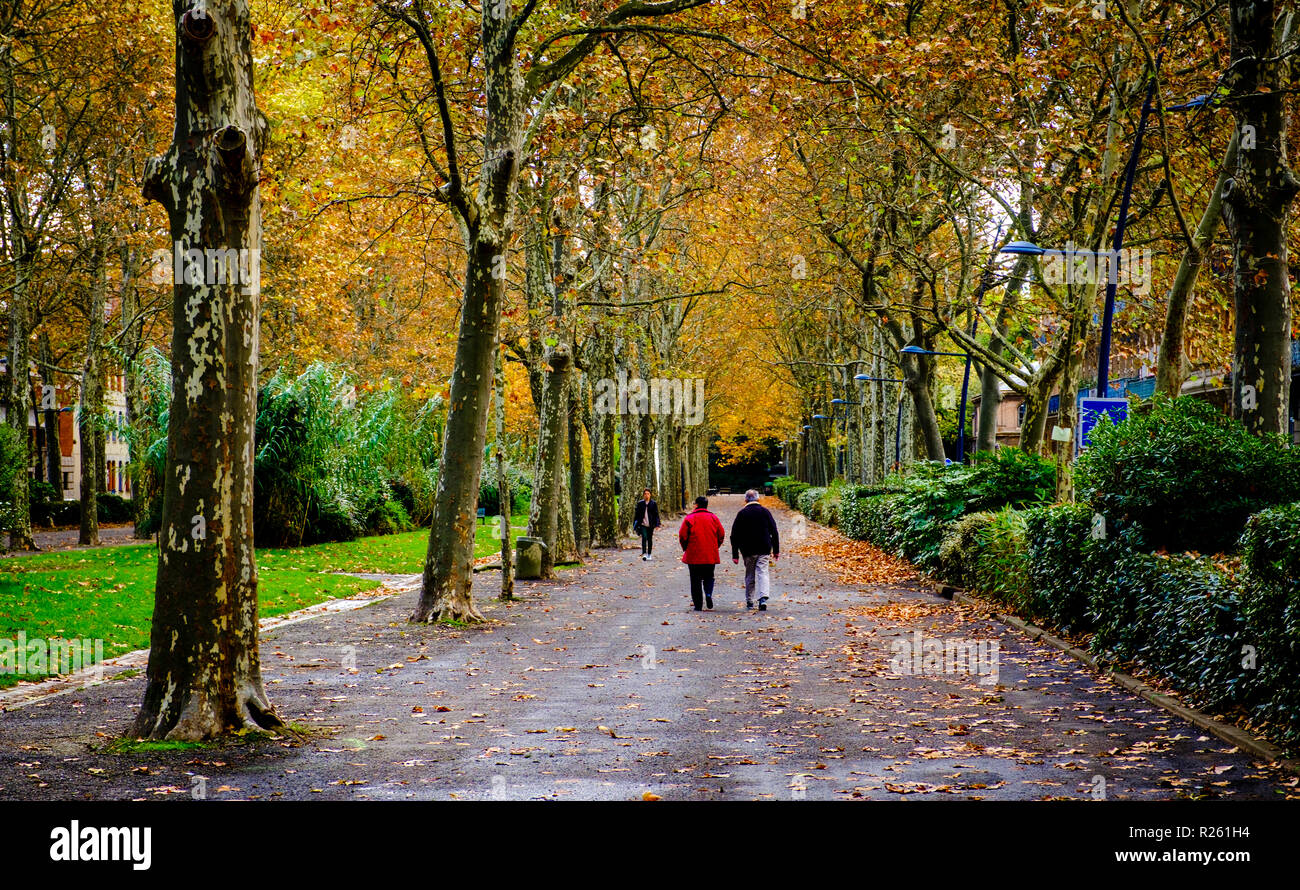 People walking in a park in the centre of Toulouse, France Stock Photo