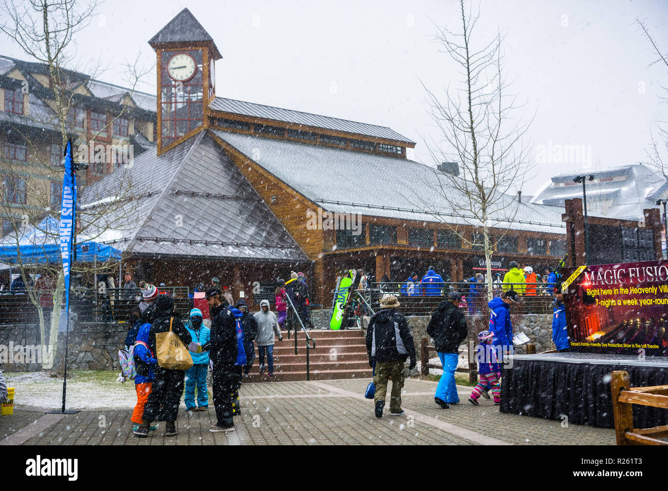 March 24, 2018 South Lake Tahoe / CA / USA - People gatheres around the Heavenly Ski Gondola starting point on a morning with heavy snowing Stock Photo