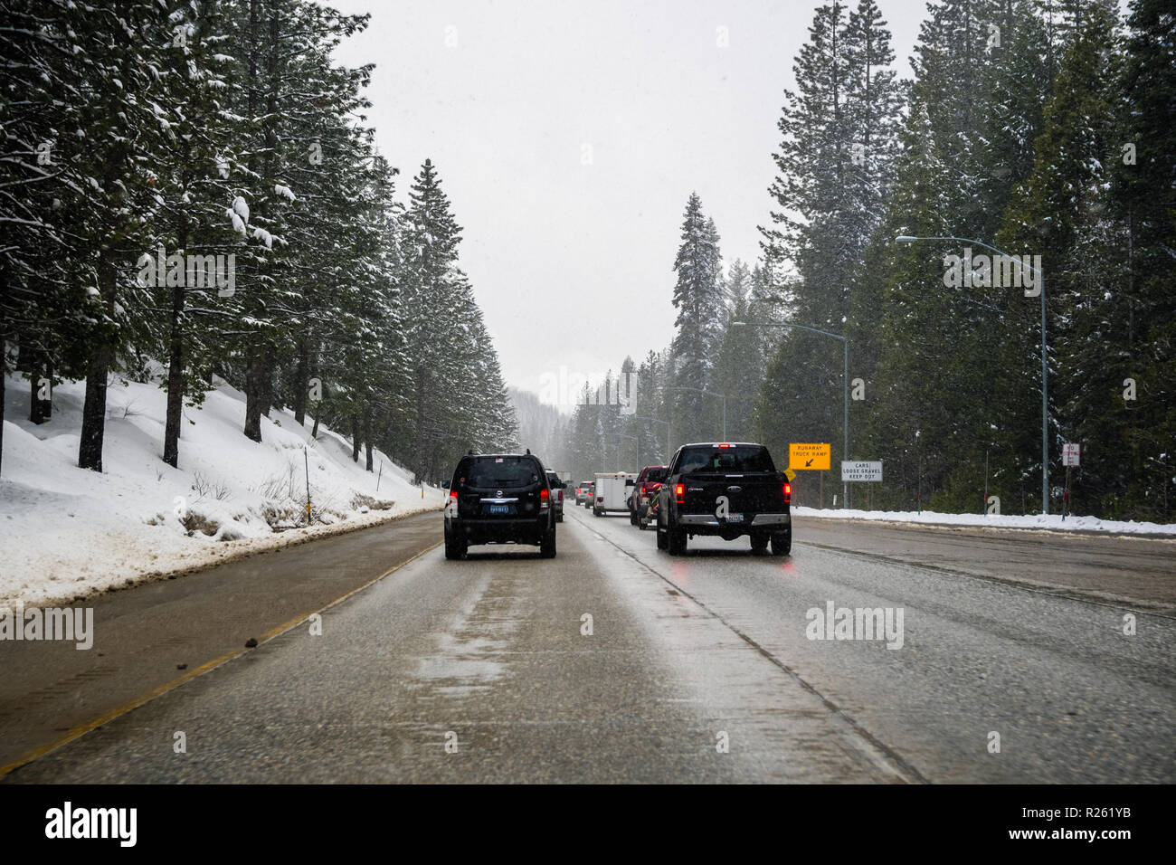 Snow falling on wet highway hires stock photography and images Alamy