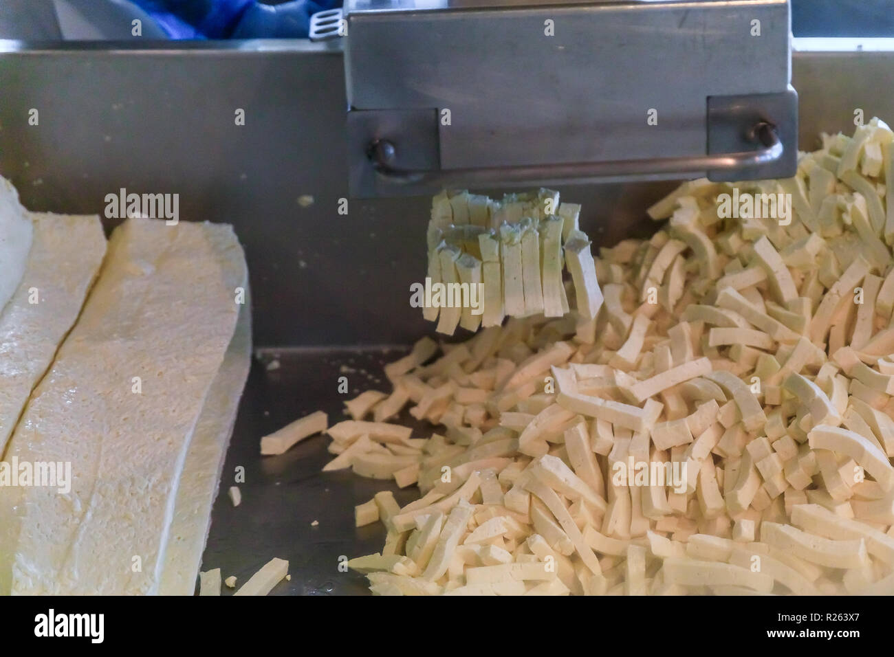 Seattle, United States November 08, 2018 Industrial cheese curd manufacturing machine at work