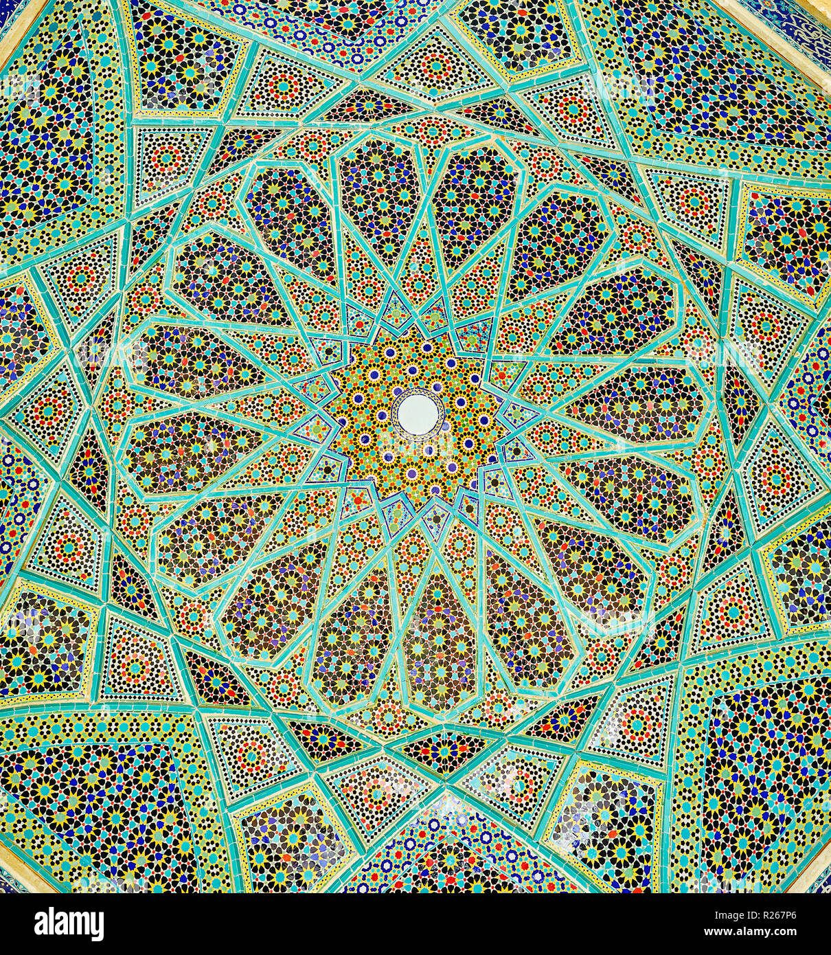 The close-up of intricate Persian mosaic patterns of dome of the open