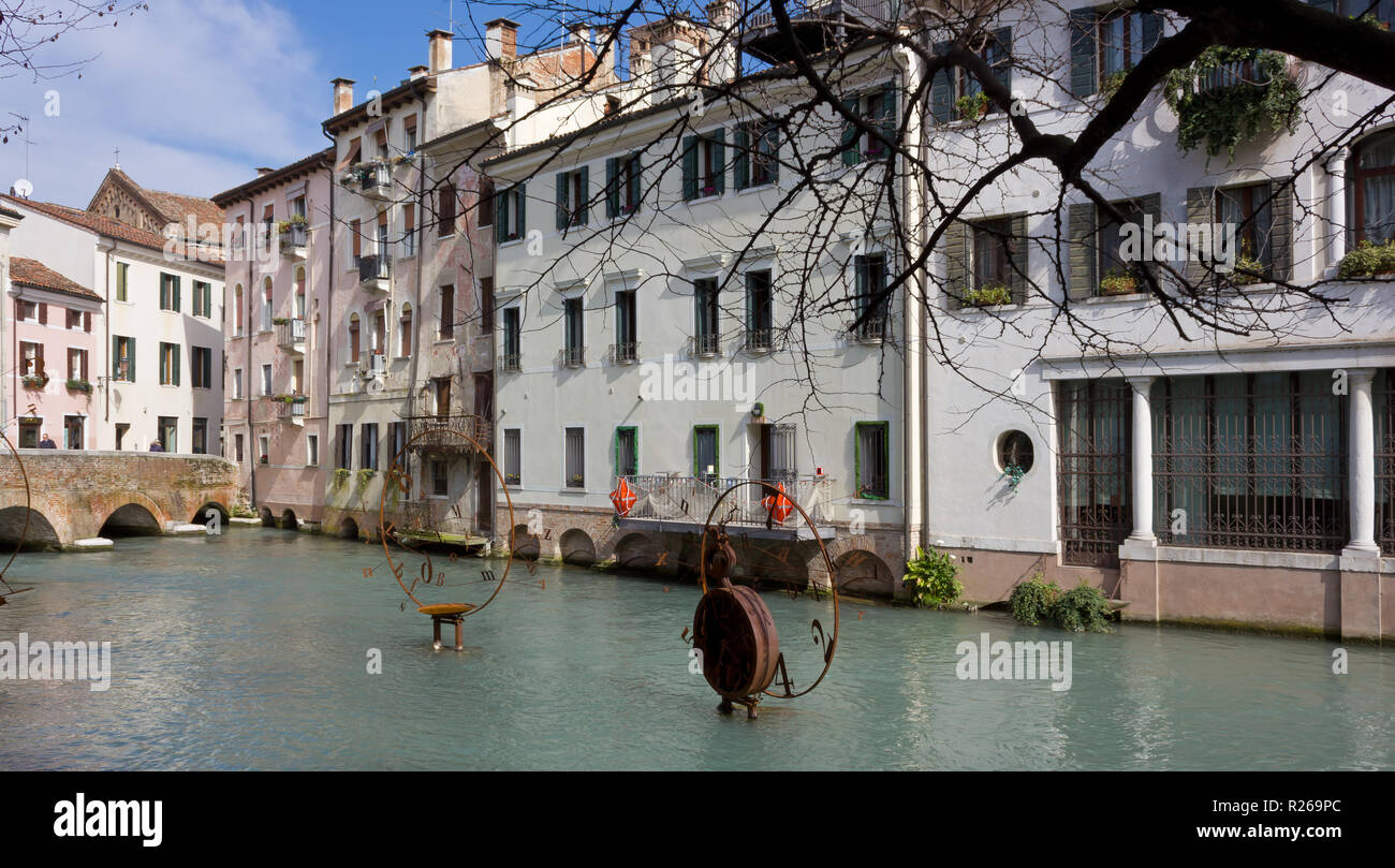 TREVISO, Italy - March 6, 2014: A few modern artworks in a canal in the old town Stock Photo