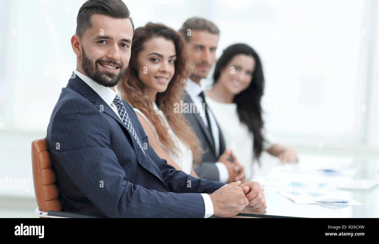 group-of-business-people-sitting-at-the-desktop-stock-photo-alamy