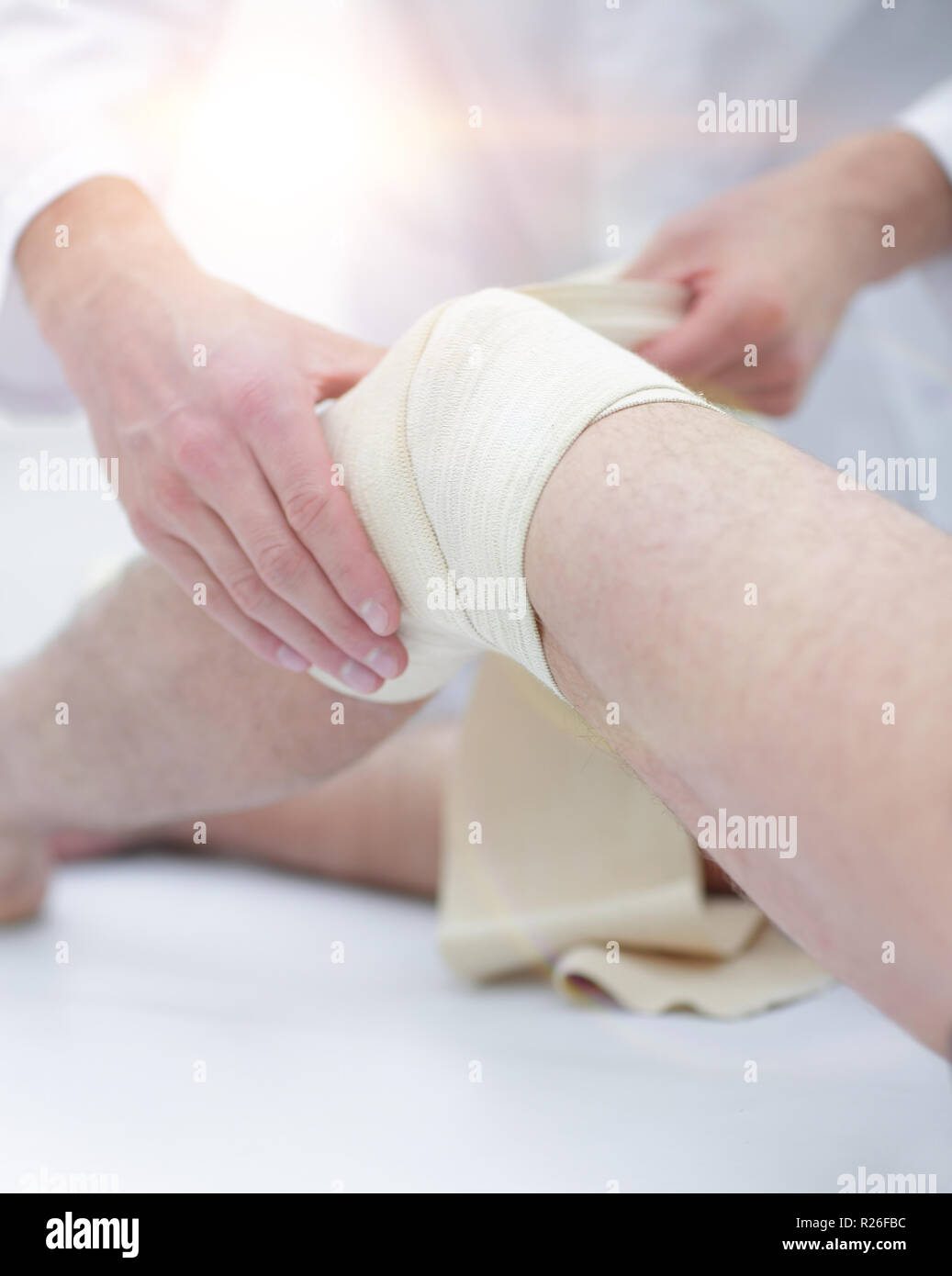 Doctor treats wound on the patient's leg in a clinic room Stock Photo Alamy