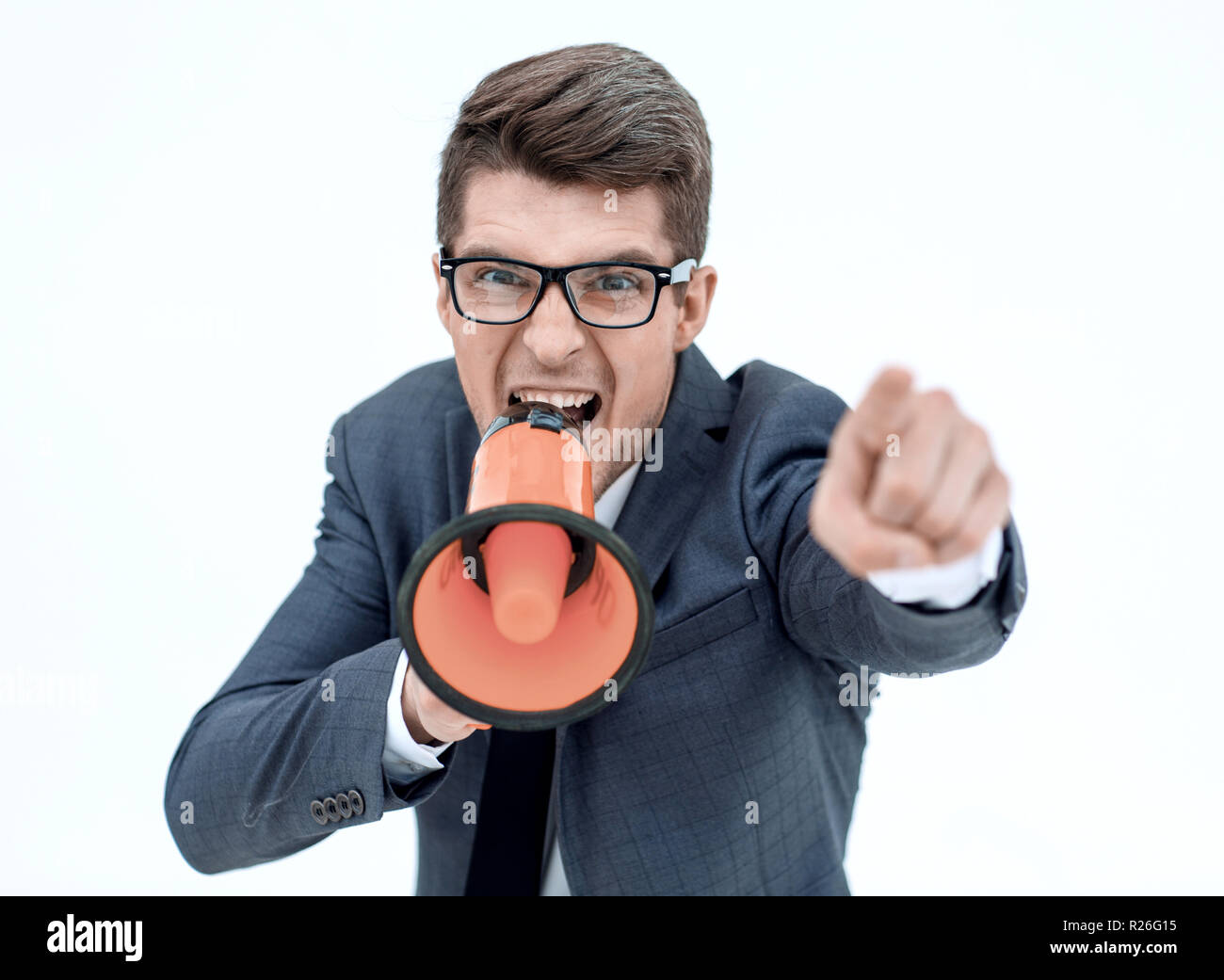 close up. angry businessman with a megaphone Stock Photo