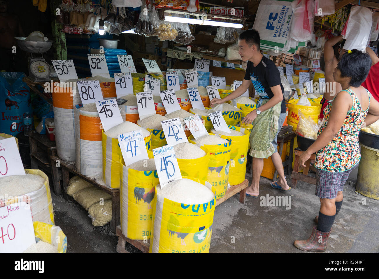 Different rice varieties being sold at a market stall in the Carbon Market,Cebu City.Could also be used as a concept image illustrating price increase Stock Photo