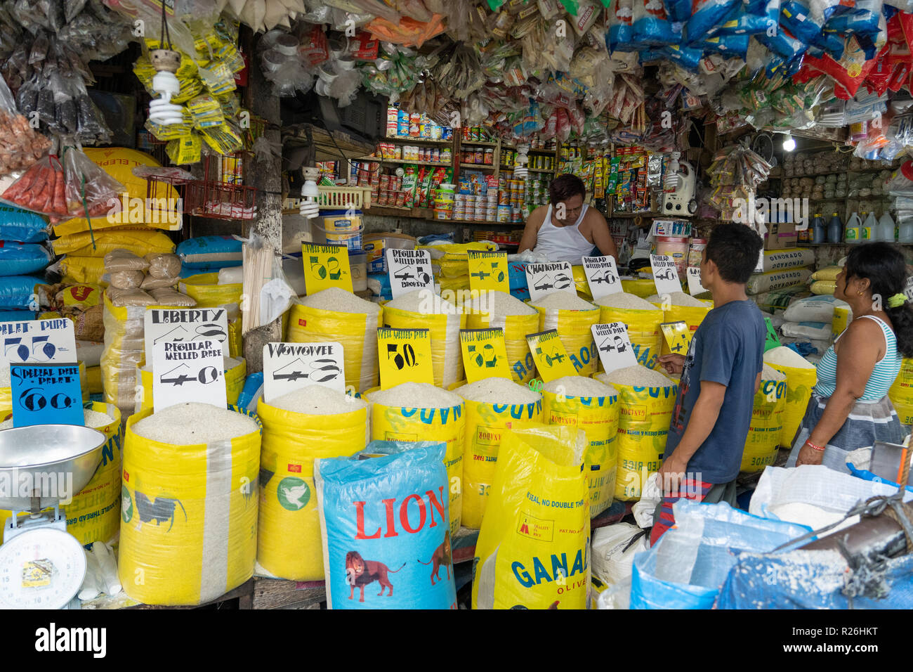 Different rice varieties being sold at a market stall in the Carbon Market,Cebu City.Could also be used as a concept image illustrating price increase Stock Photo