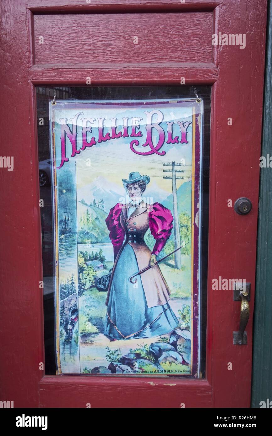 Nellie Bly Poster Drawing Art at Kaleidoscope Store Door, once Jennie Bauters Brothel on Main Street in City of Jerome, Arizona Stock Photo