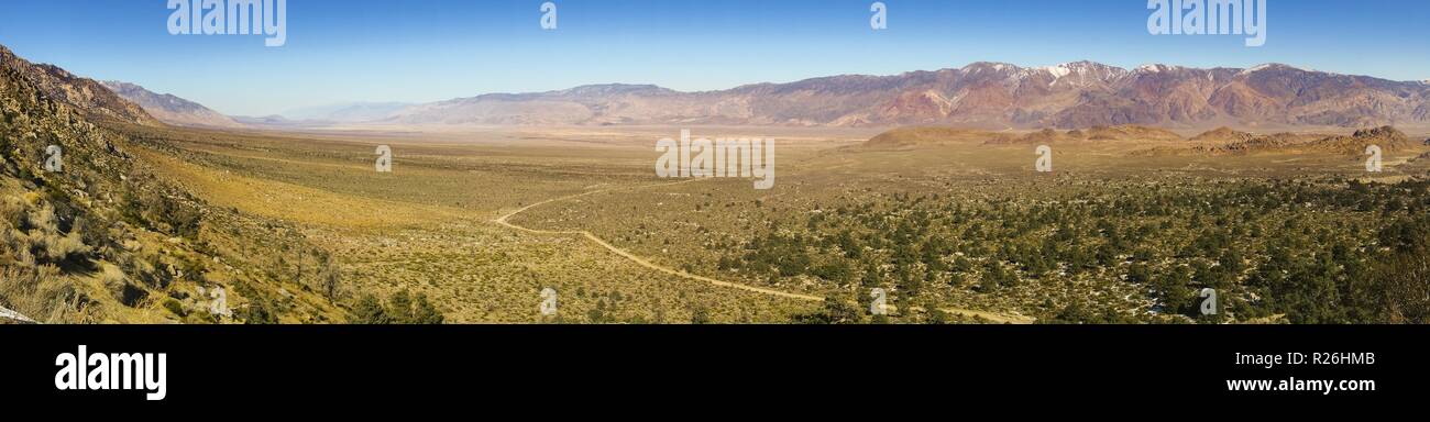 Wide Panoramic Landscape View of Owens Valley and US Plains from Alabama Hills east of Sierra Nevada Mountains above Lone Pine California Stock Photo