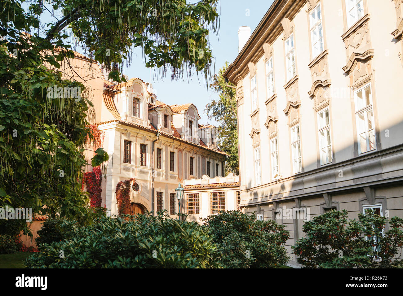 Exterior of a traditional old building with many windows among the trees in Prague in the Czech Republic. Stock Photo