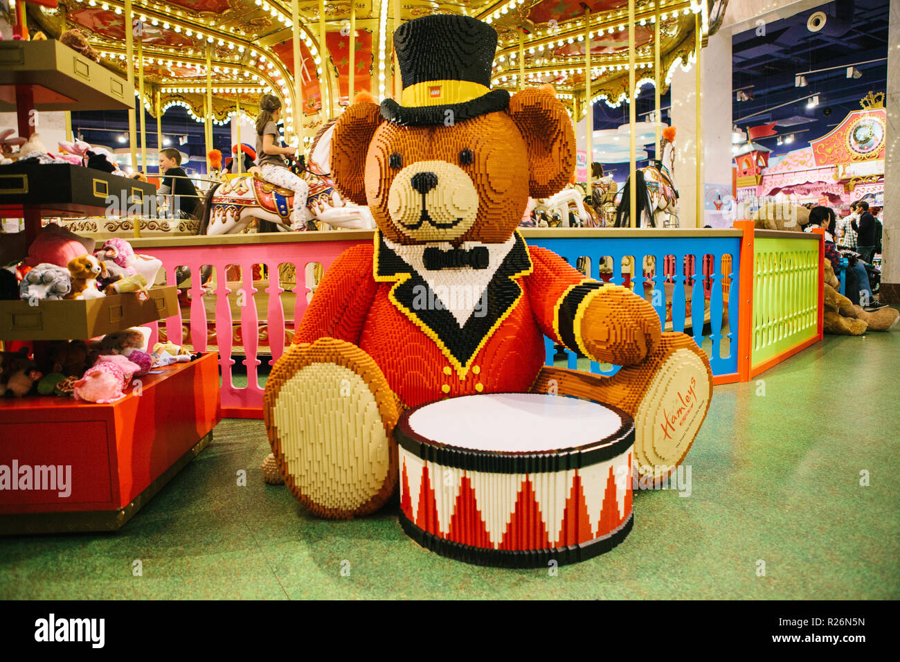 Prague September 29, 2018: A huge bear with a drum made from Lego in a toy  store Hamleys. In the background is a carousel Stock Photo - Alamy