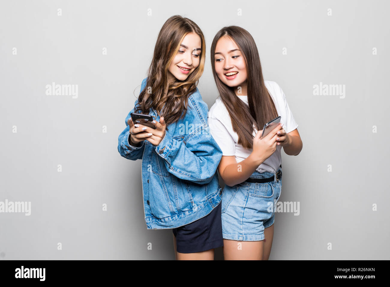 Two multiethnic summer women expressing excitement or surprise while ...