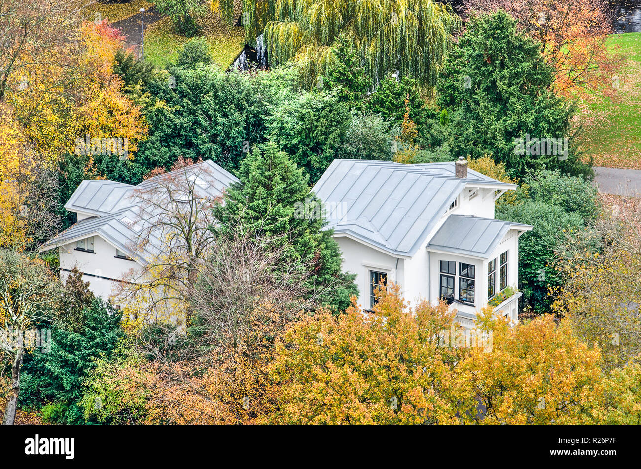 Rotterdam, The Netherlands, November 12, 2018: aerial view of the former coach-house in The Park, now in use as a cafe, surrounded by trees in autumn  Stock Photo